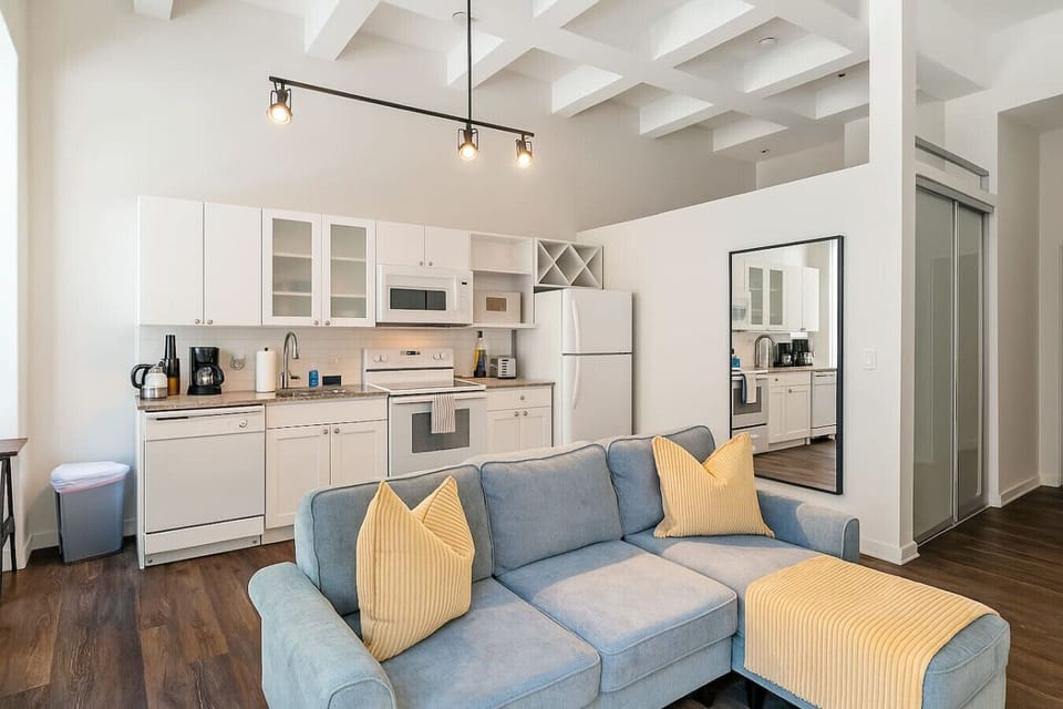 An open-concept area featuring a modern furnishings, and a stylish entertainment setup—ideal for gatherings and relaxation.