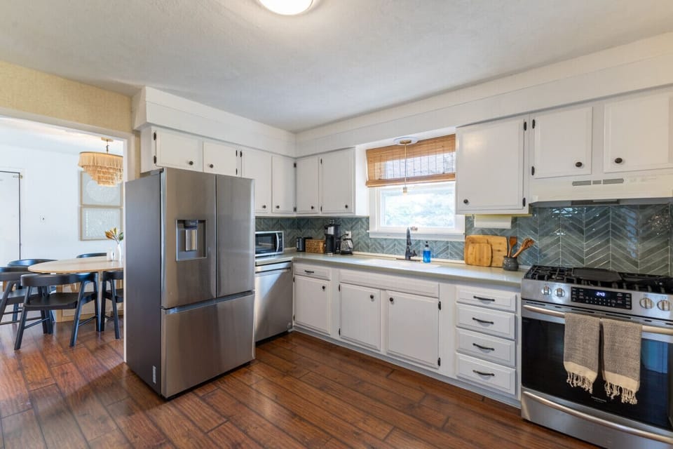 Cook up comfort—this modern kitchen has everything you need, from stainless steel appliances to ample counter space.