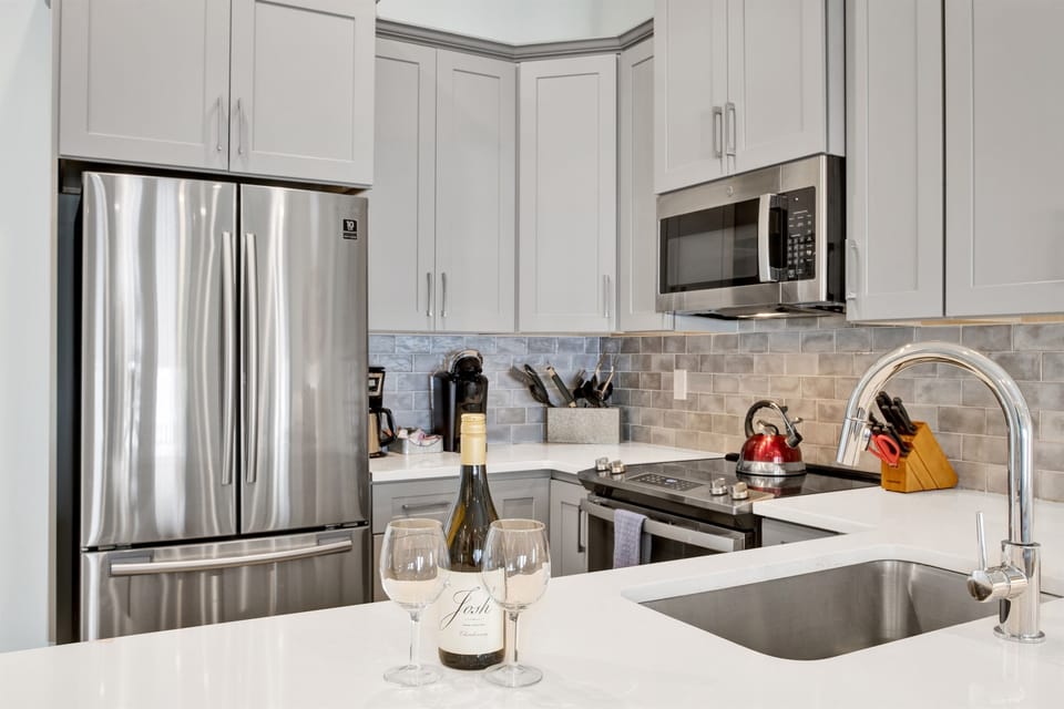 Kitchen fully stocked with everything from gourmet cooking essentials to endless coffee options