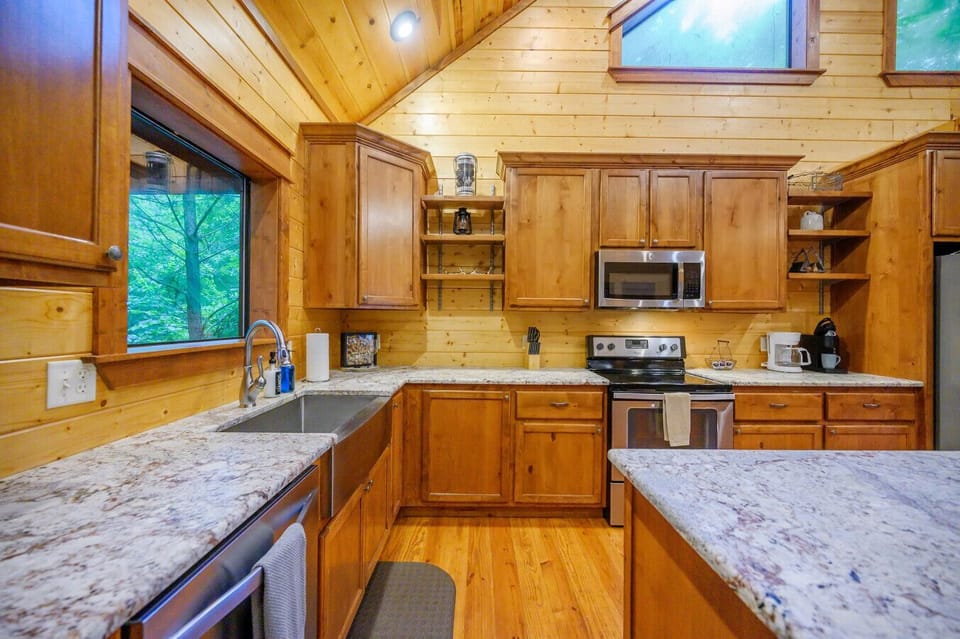Fully stocked kitchen with modern appliances and rustic style.