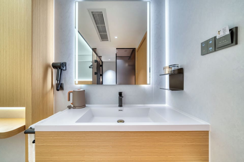 Shower, free toiletries, hair dryer, slippers