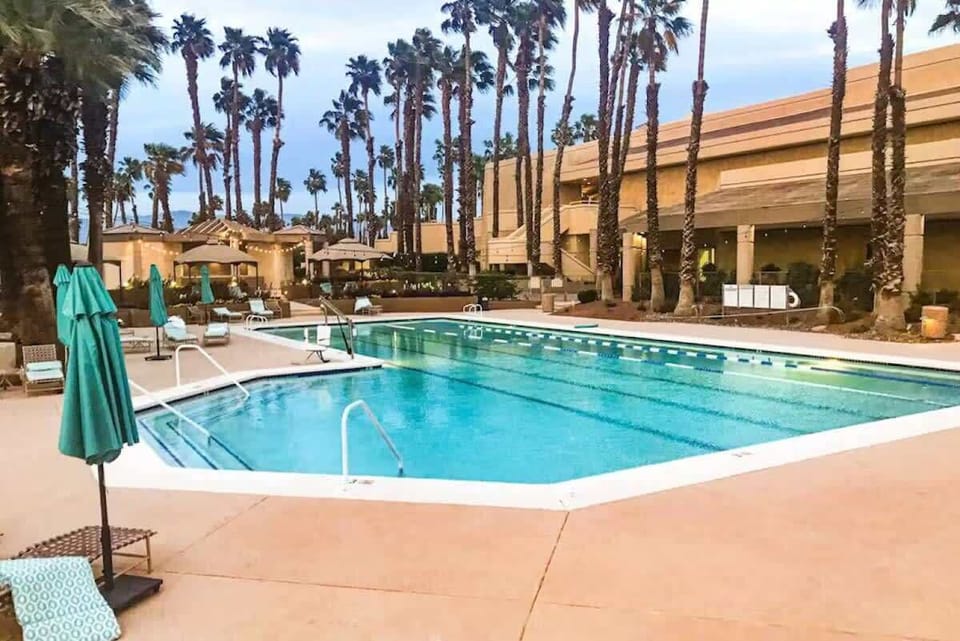 Relax by the sparkling community pool under sunny skies
