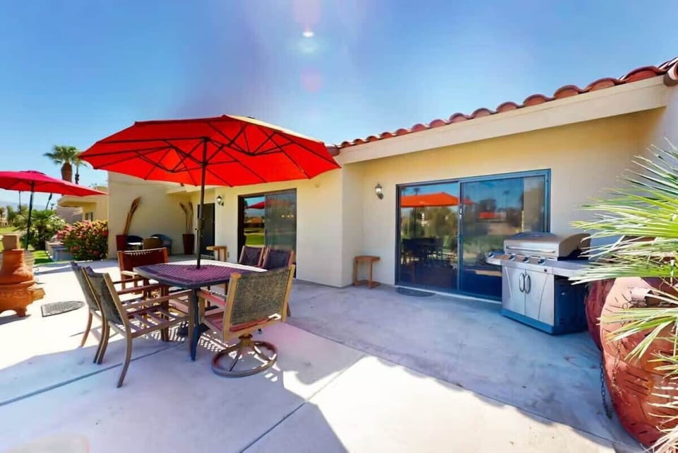 Shaded outdoor dining area perfect for relaxing and meals al fresco