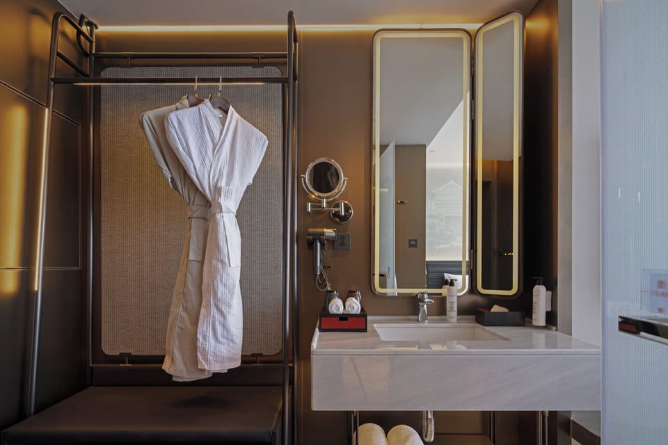 Grand Deluxe King | Bathroom | Rainfall showerhead, free toiletries, hair dryer, bathrobes