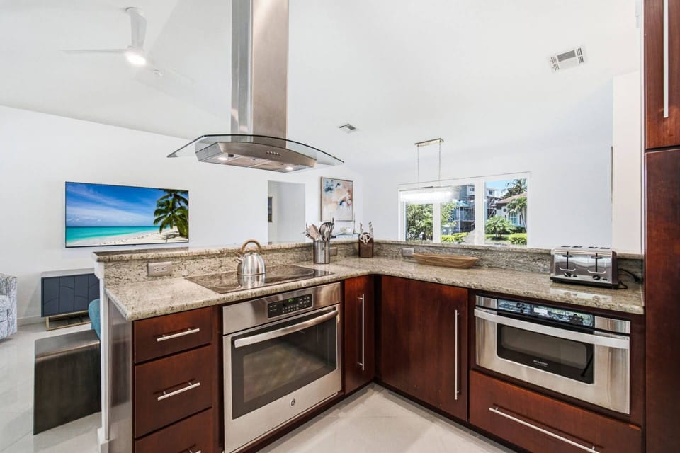The kitchen features high-end, updated appliances