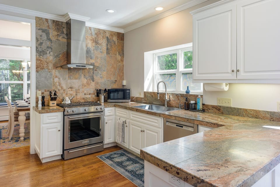 William-Sonoma complete kitchen with quartz countertops and tons of space for prepping meals.