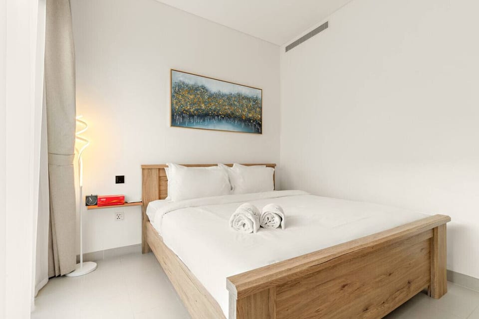 Bedroom: Relax in style with soft linens, modern decor, and warm lighting for dreamy nights!