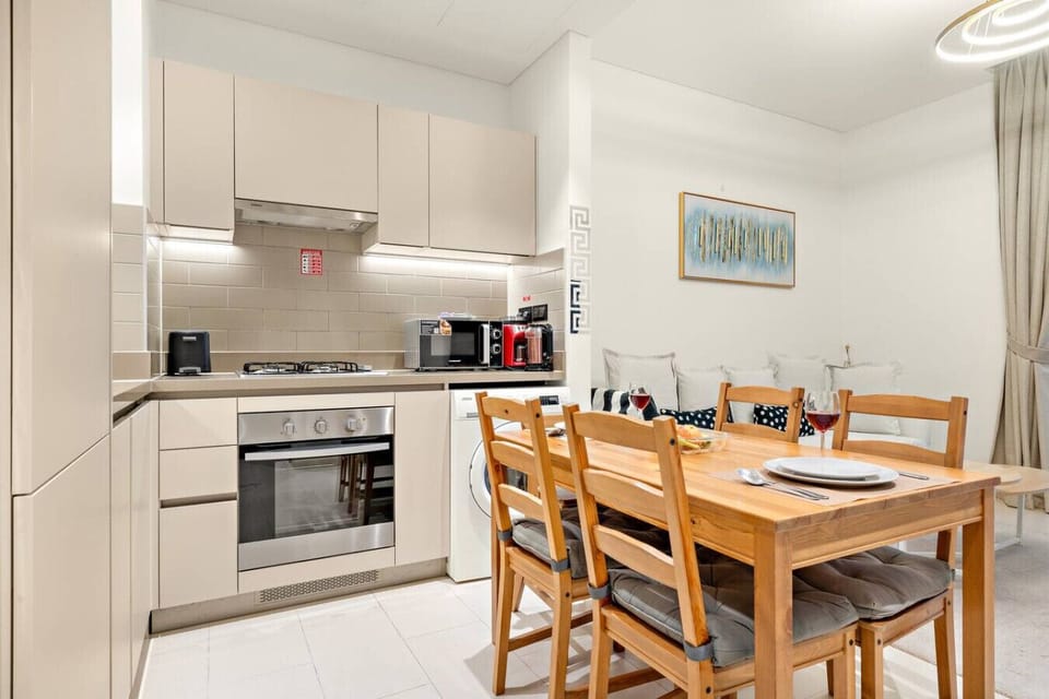 Dining Area: Sleek kitchen with modern appliances, perfect for culinary adventures and gatherings!