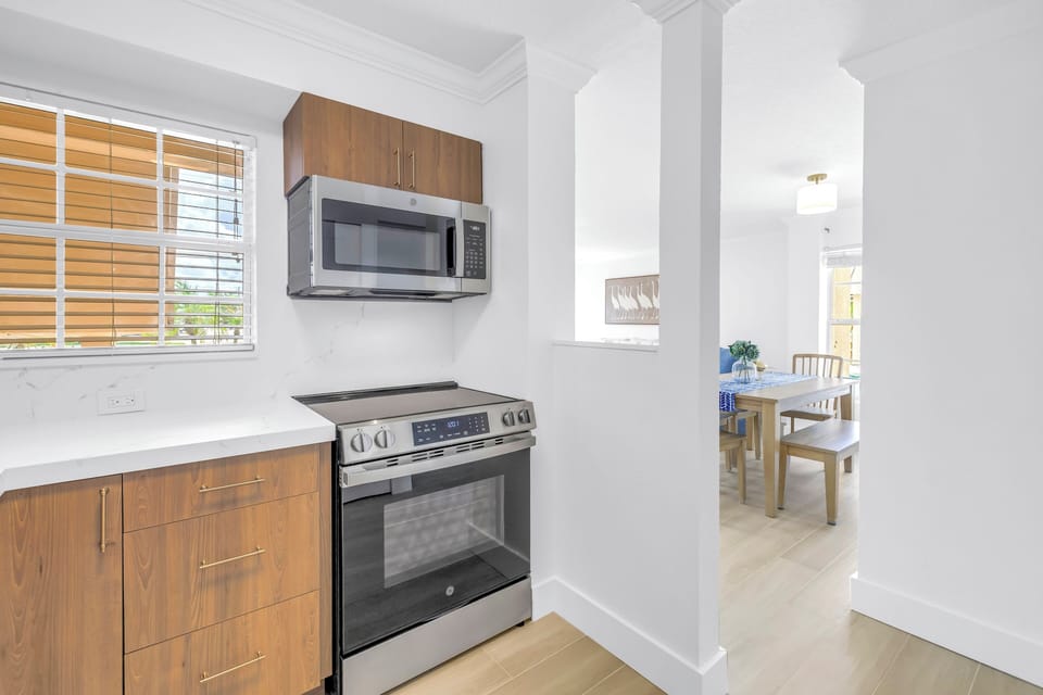 Kitchen adjacent to dining area.