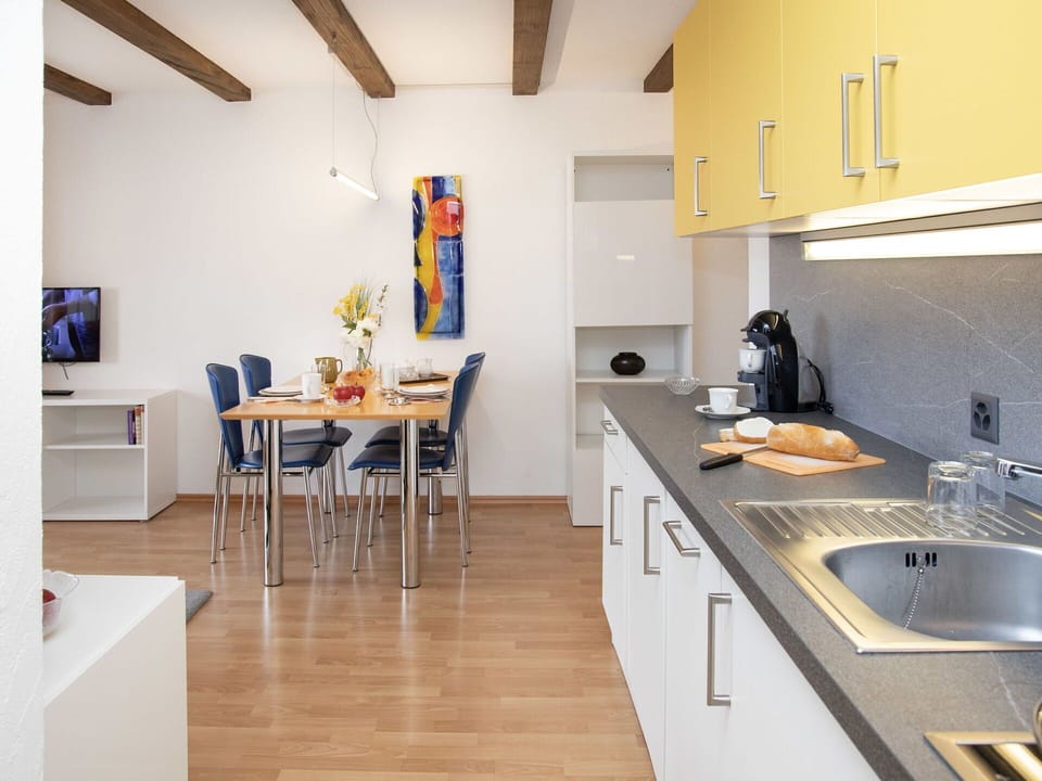 Interior Design, Flooring, Furniture, Kitchen, Floor, Countertop, Ceiling, Room, Kitchen Appliance, Chair