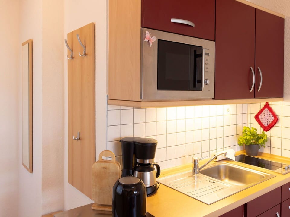Kitchen, Countertop, Kitchen Appliance, Wood, Cabinetry, Major Appliance, Kitchen Sink, Interior Design, Sink, Flooring