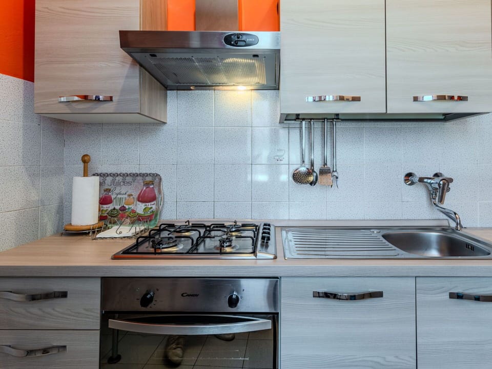 Kitchen Appliance, Kitchen, Countertop, Kitchen Stove, Major Appliance, Stove, Cabinetry, Kitchen Sink, Gas Stove, Home Appliance
