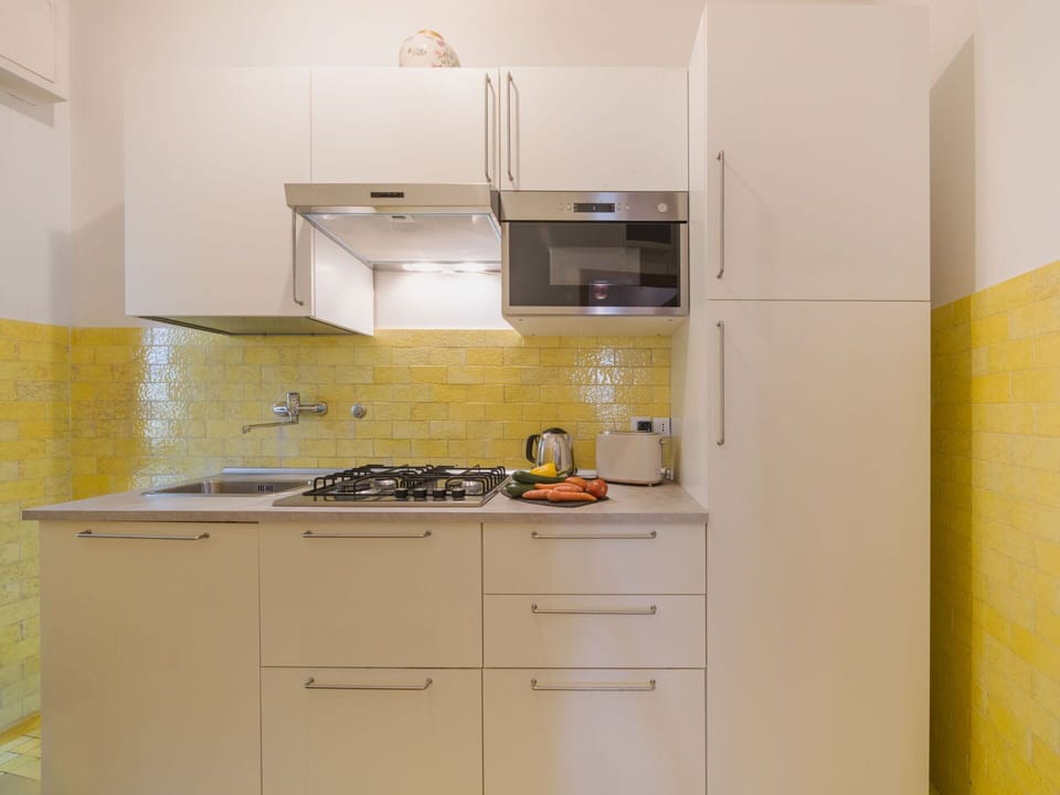 Kitchen, Kitchen Appliance, Countertop, Major Appliance, Wall, Flooring, Wood, Interior Design, Cabinetry, Yellow