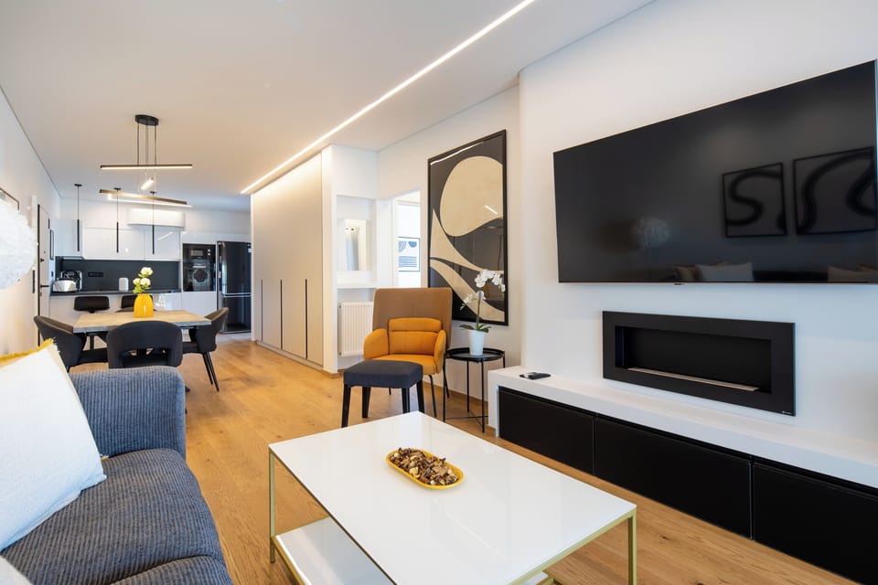 Apartment, 2 Bedrooms, Kitchen, City View | Living room | 50-inch Smart TV with digital channels, streaming services