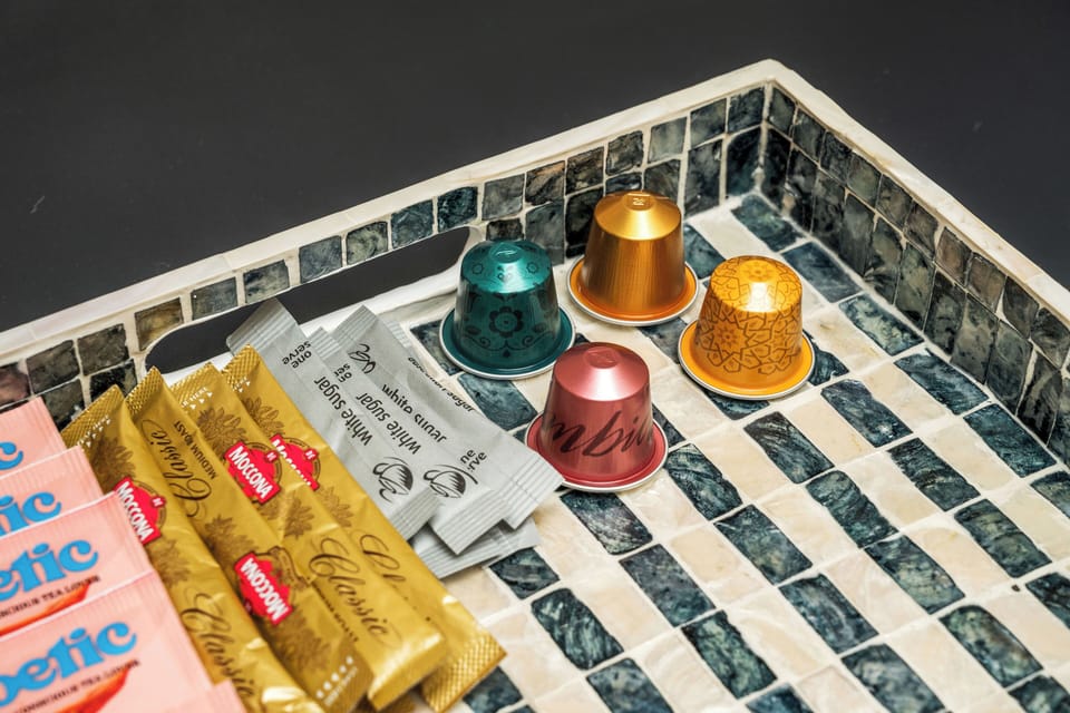 Coffee lovers rejoice! A selection of coffee pods and sugar provided for your convenience. 