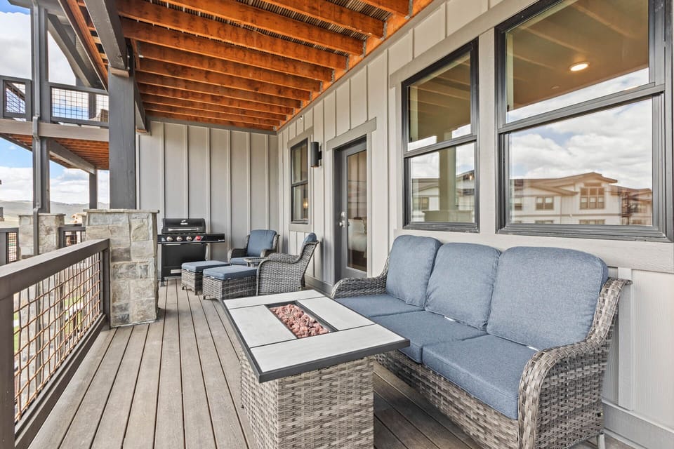 Settle into your private covered deck where plush seating and a fire pit table create the perfect spot for relaxing evenings. Fire up the BBQ while you unwind in mountain air under the warmth of exposed beams.