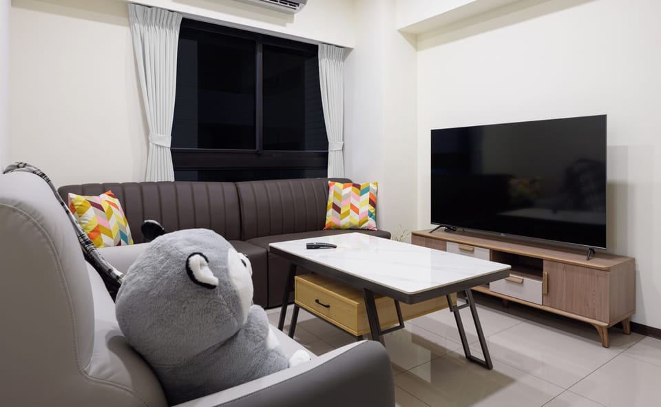 plenty of couch seating, higher coffee table, 65" smart LED TV