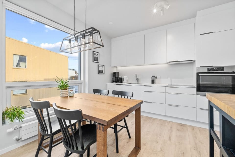 Our kitchen and dining area is perfectly situated by the window so you can enjoy the view of the peaceful neighborhood even while having your meal