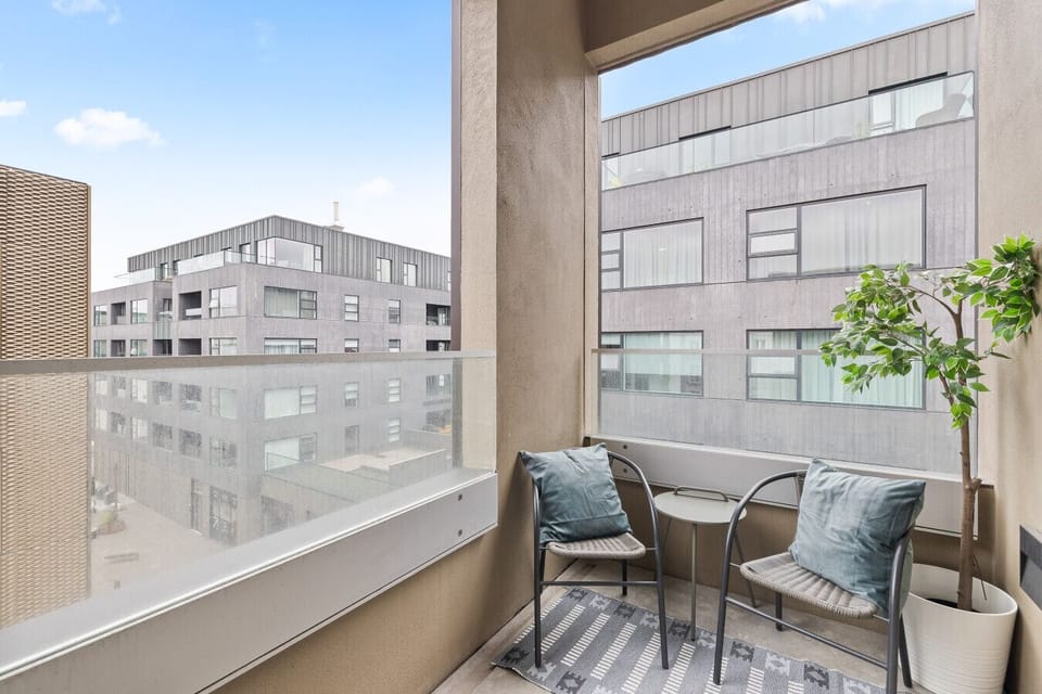 Balcony with cozy outdoor seating and  with a view 🌿✨