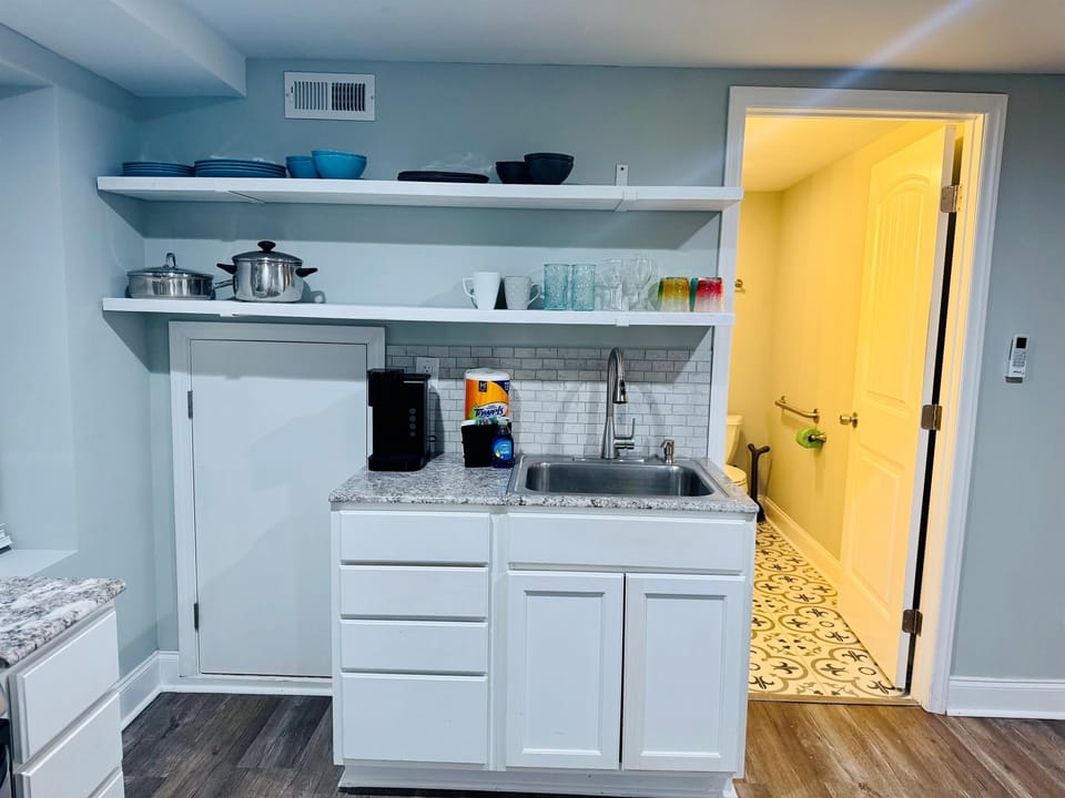 Kitchen with sink and Keurig coffee maker.