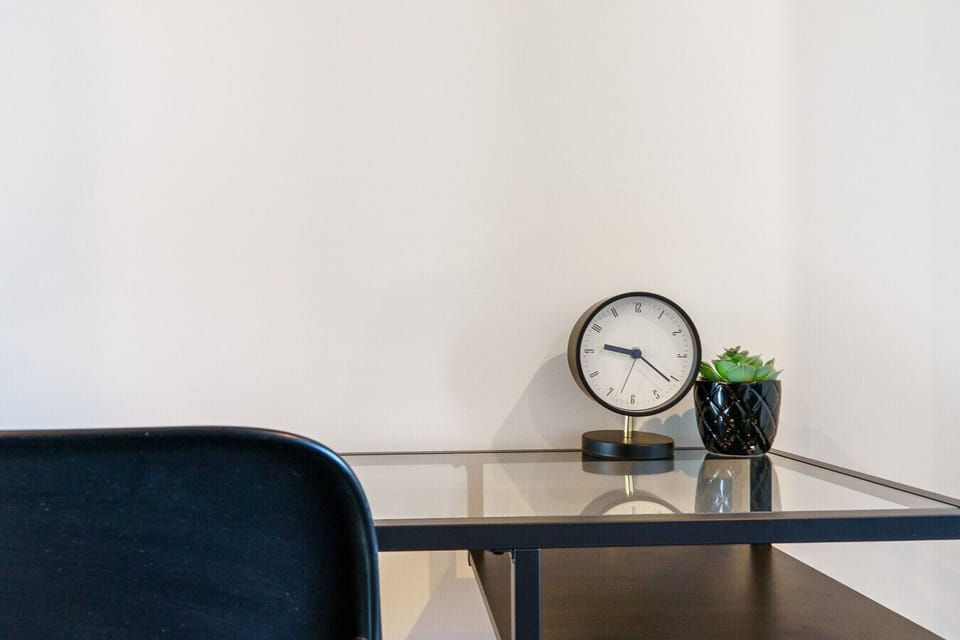 Functional work nook with a clean desk and a dedicated chair—ideal for focused work or study.