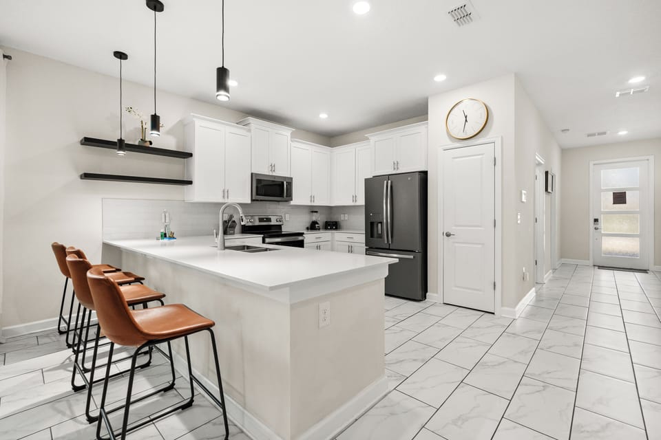 Kitchen Island That Seats 4 People & Kitchen In Background