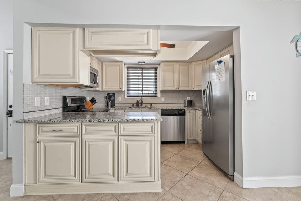 Full kitchen with stainless steel appliances