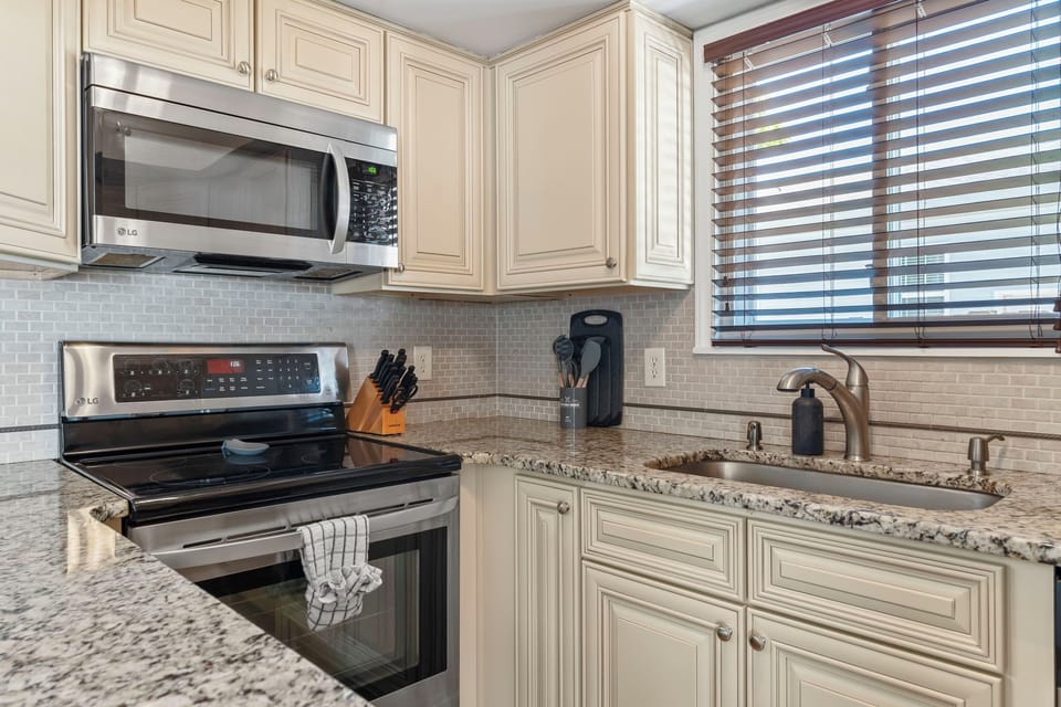 Full kitchen with stainless steel appliances
