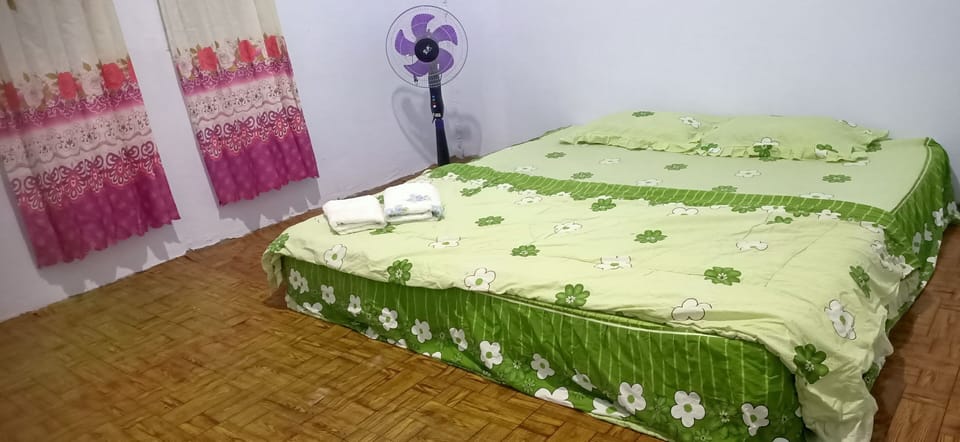 Laptop workspace, blackout drapes, bed sheets