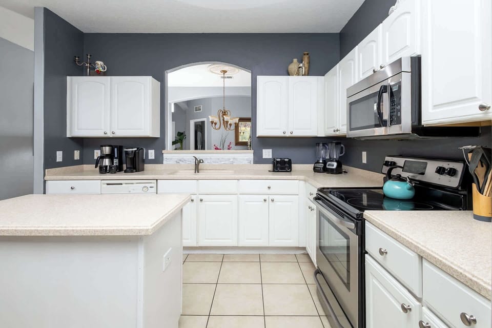 House, Multiple Beds, Pool Access, Garden View (Be Our Guest at Emerald Island) | Private kitchen | Coffee/tea maker, fridge, microwave, oven