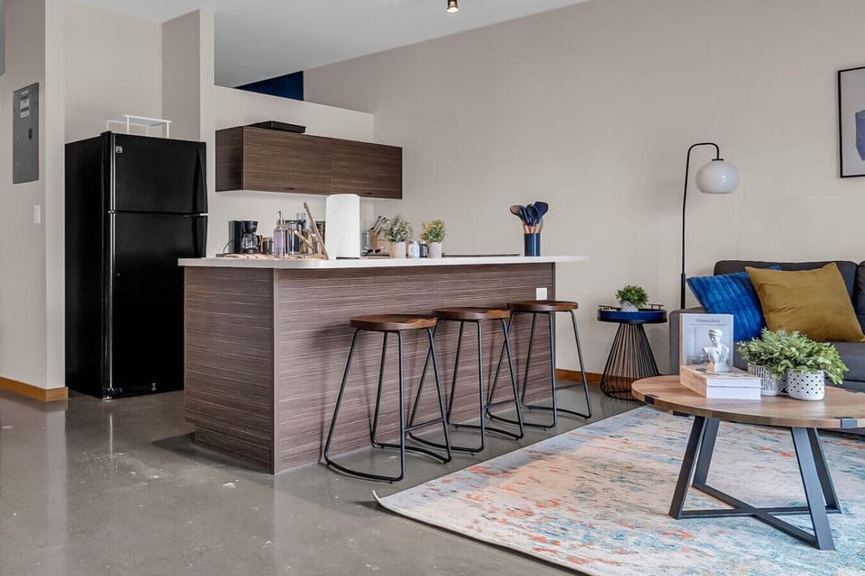 An open-concept area featuring a modern furnishings, and a stylish entertainment setup—ideal for gatherings and relaxation.
