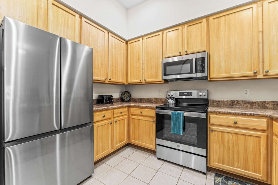 Condo, Multiple Beds, Balcony, Garden View (Slice Of Sunshine At Caribe Cove) | Private kitchen | Fridge, microwave, oven, stovetop