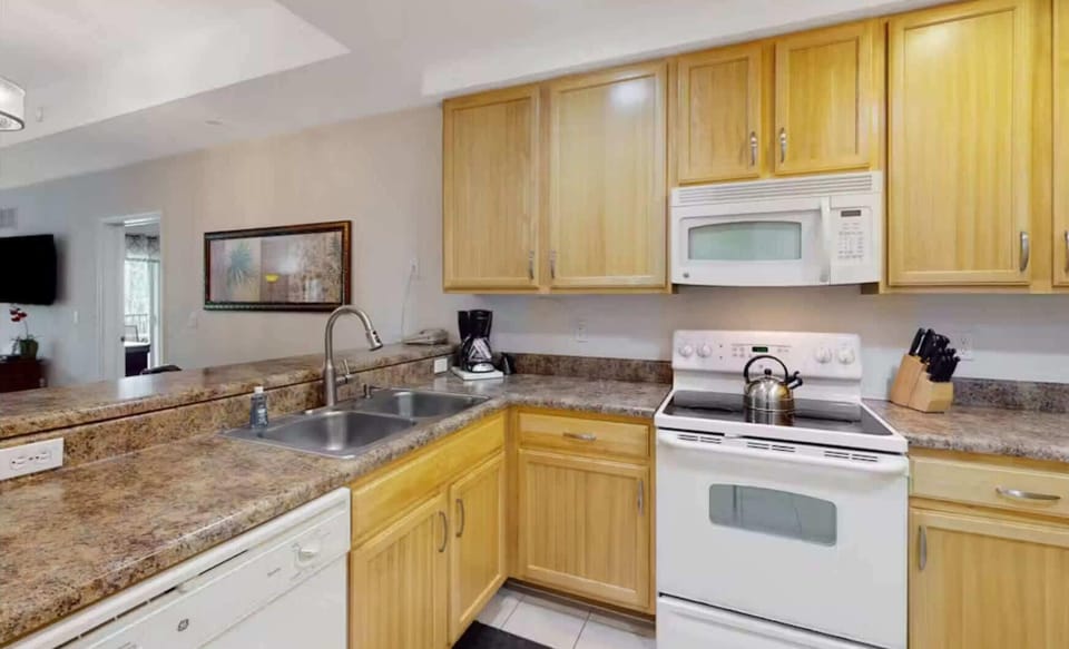Condo, Multiple Beds, Balcony, Garden View (Sunny Haven At Caribe Cove) | Private kitchen | Fridge, microwave, oven, stovetop