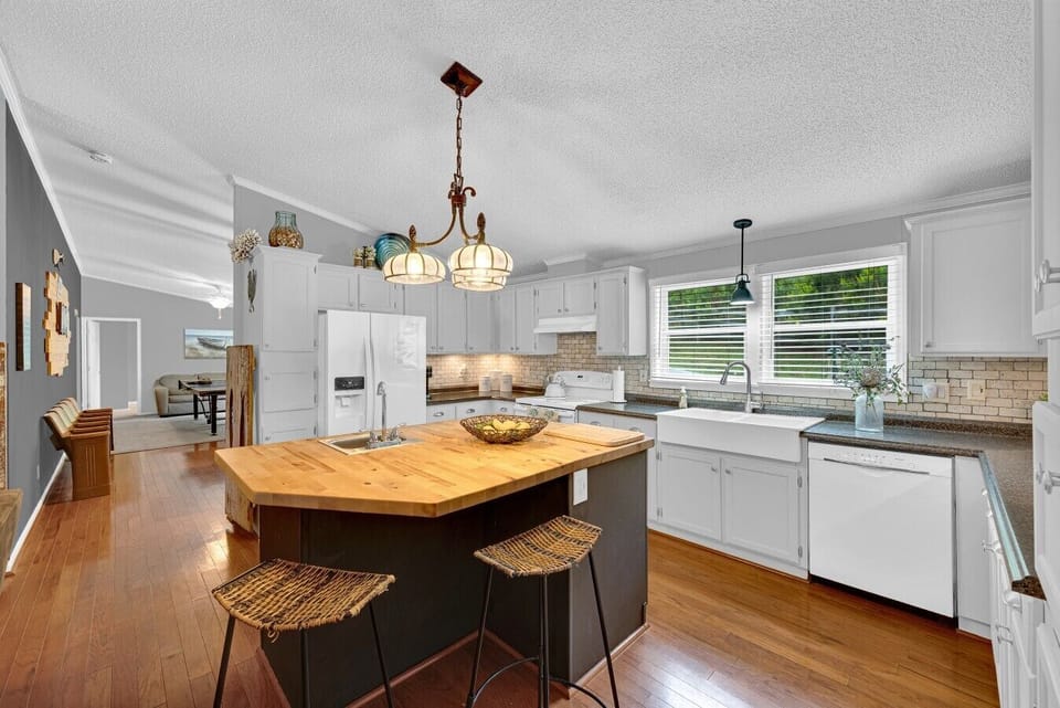 Kitchen | Butcher Block Island | Farmhouse Sink & White Cabinetry