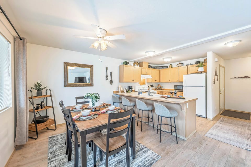 Dining room table seats six with bar seating for four