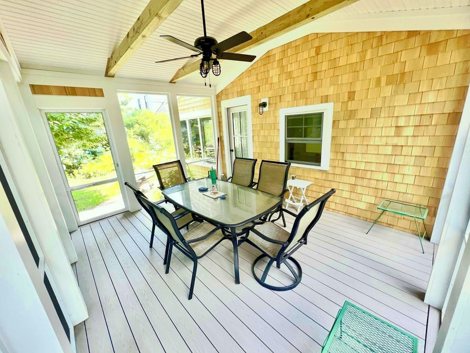 New porch with ceiling fan. Enjoy outdoor dining all day and night, no bugs.