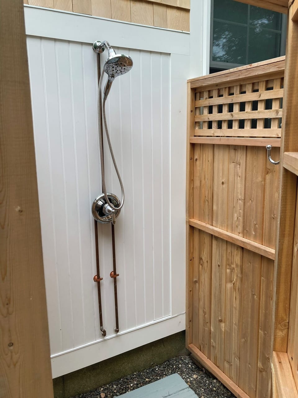 Outdoor cedar shower - with detachable hand shower sprayer.