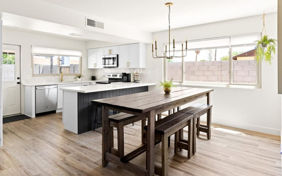 Modern dining area with a spacious, fully-equipped kitchen