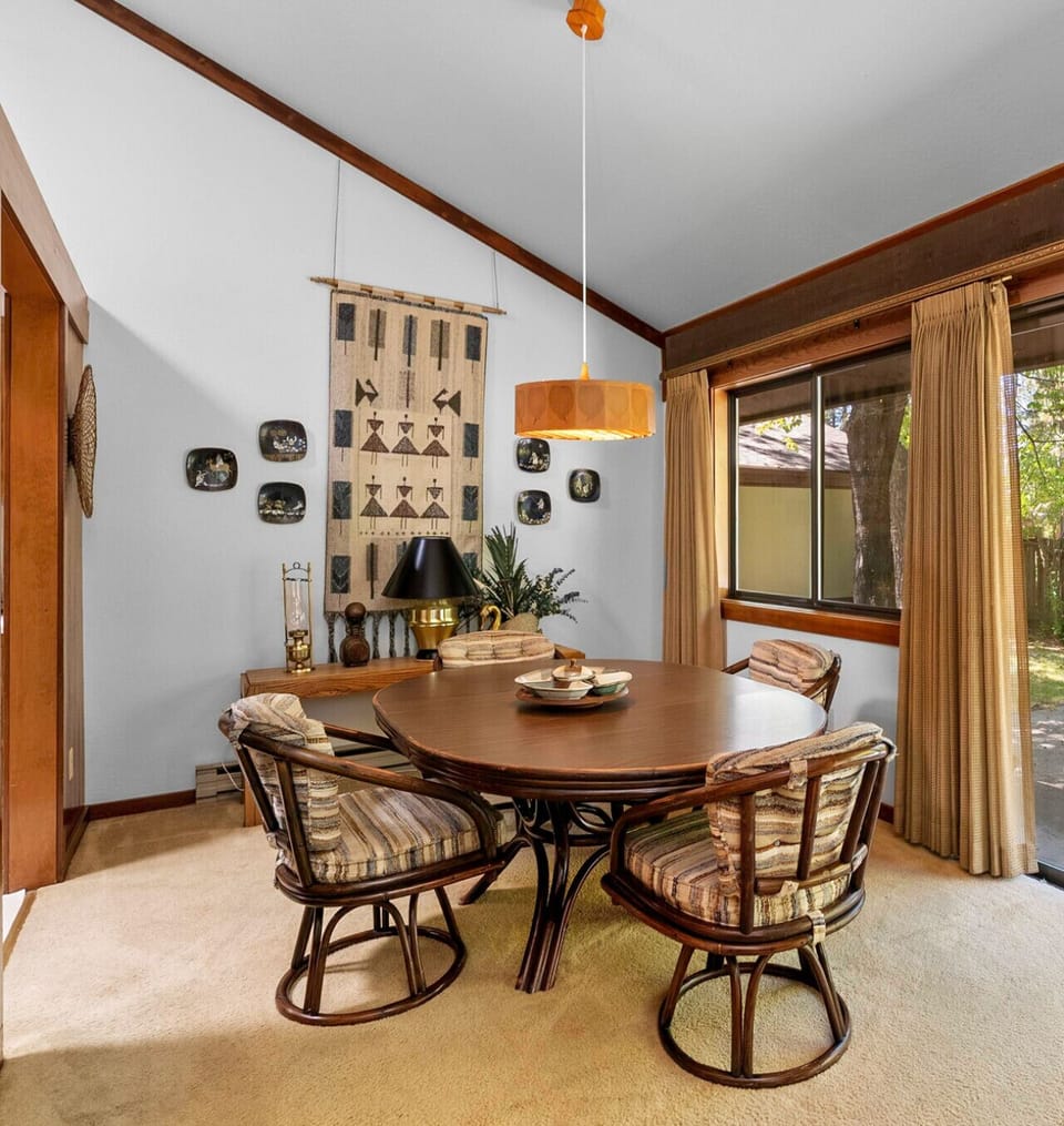 Dining area seats four and flows into galley kitchen
