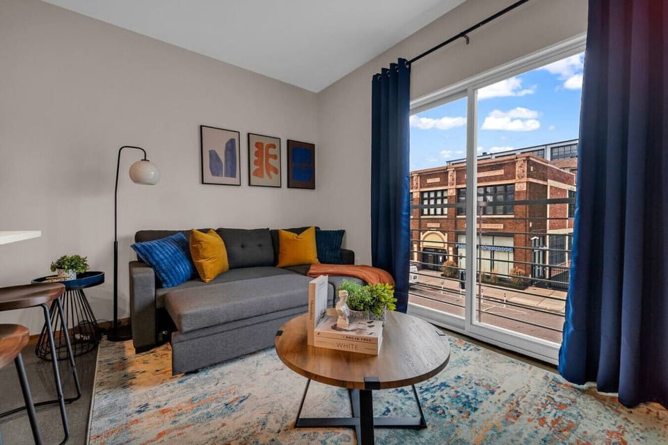 The living room is filled with natural light, creating a bright and welcoming space that invites relaxation.