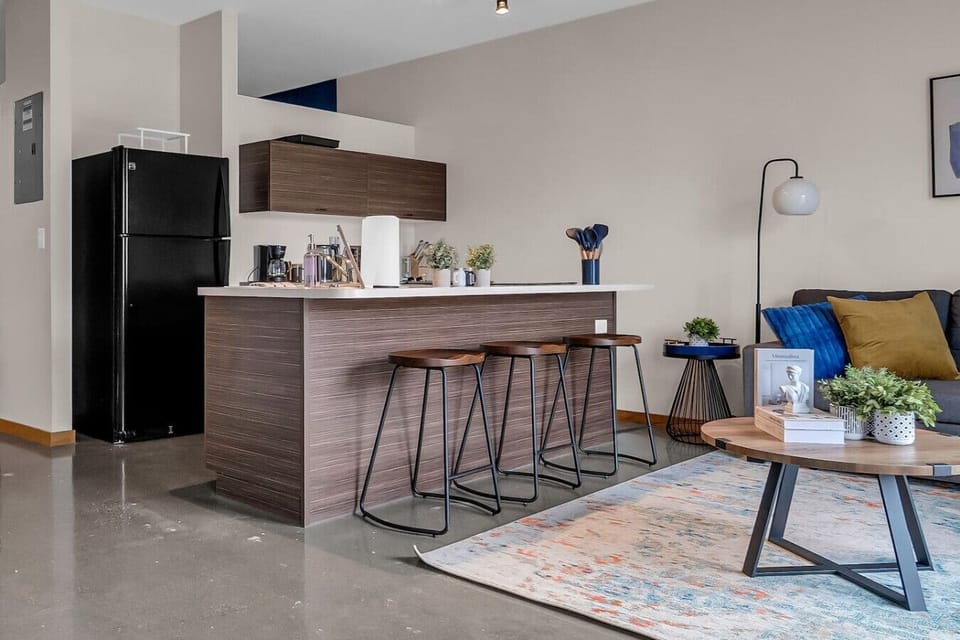 An open-concept area featuring a modern furnishings, and a stylish entertainment setup—ideal for gatherings and relaxation.