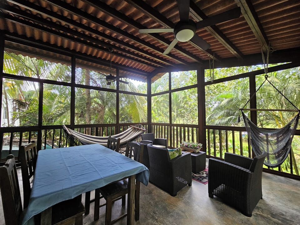 Large screened in porch. Fully furnished with dining and seating & hammock areas