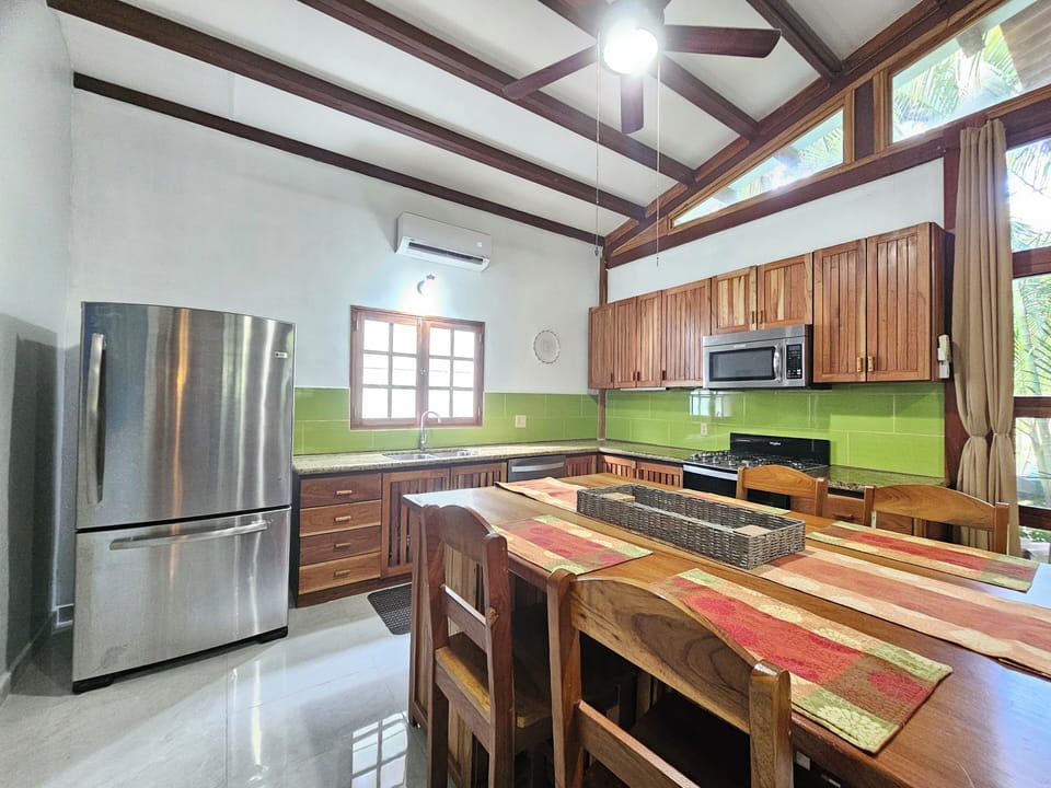 Fully equipped kitchen, granite counters, gas stove, D/W, sitting/eating island