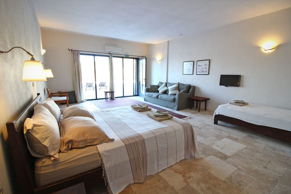 Family Triple Room | Minibar, free WiFi, bed sheets