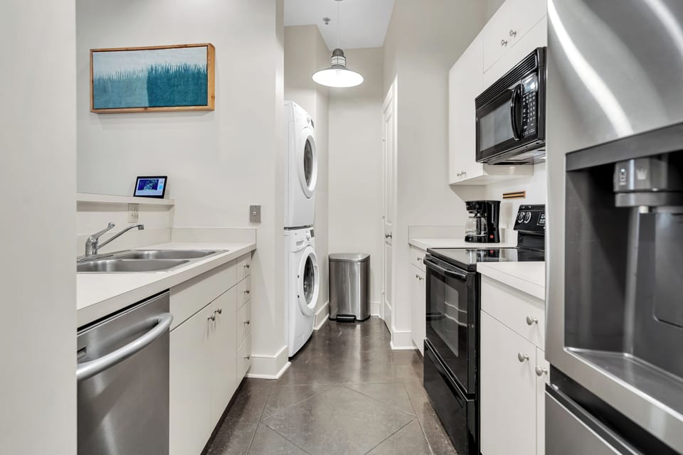 Full kitchen with in-unit laundry.