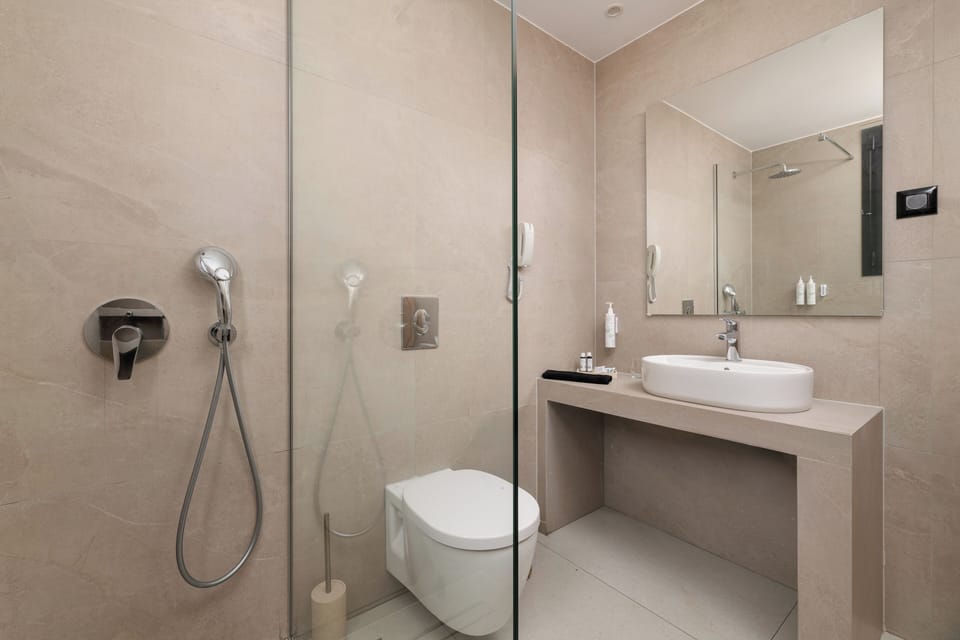 Shower, hair dryer, slippers, towels