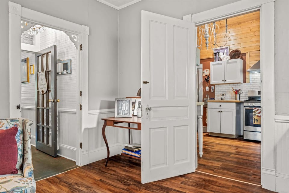 This area holds a coffee station, an entrance to the kitchen and the hallway leading back to the front door.  In addition, more seating for family time sharing and creating memories.