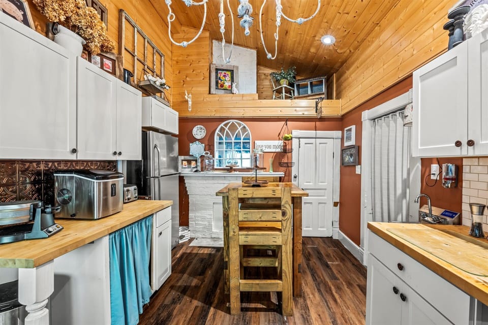 The kitchen holds also holds a full size refrigerator and dishwasher, among other handy cooking appliances.