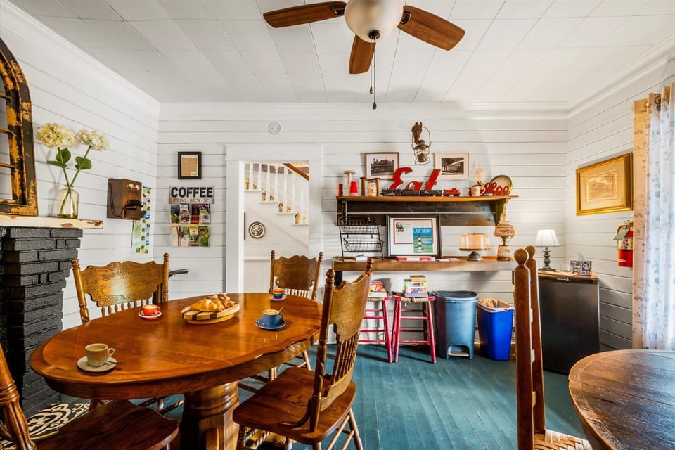 This sitting/dining room is located just inside the front entrance and across from the staircase leading upstairs. It has the perfect setting for the enjoyment of good food and good company.