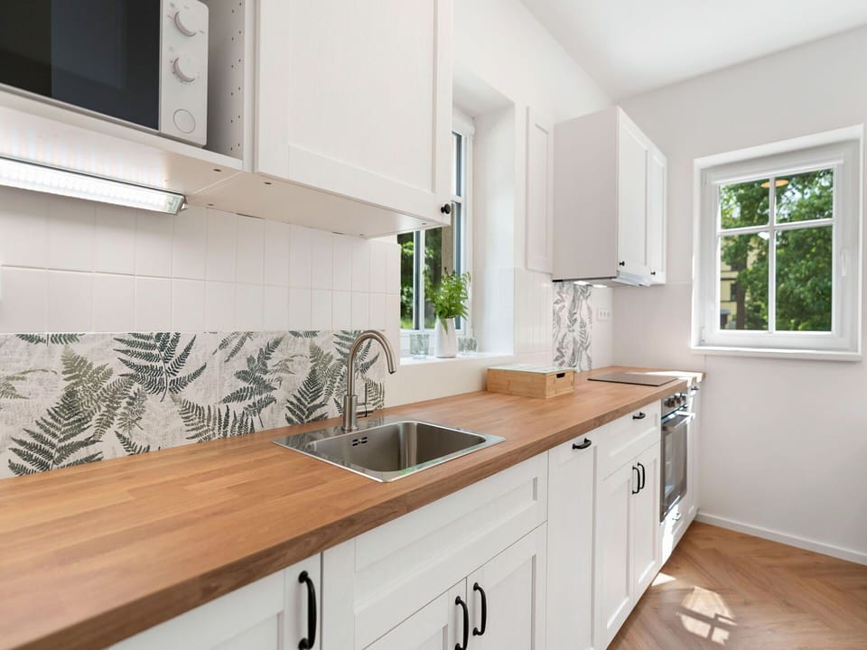 Wood, Flooring, Countertop, Kitchen, Interior Design, Plumbing Fixture, Home, Floor, Tap, Cabinetry
